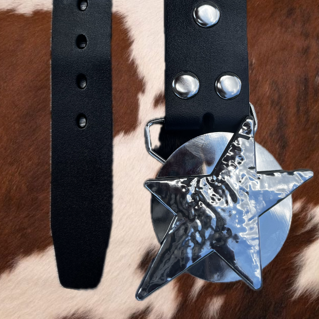 A close-up image of a silver spinnable star buckle on a black leather belt, displayed against a cowhide background.