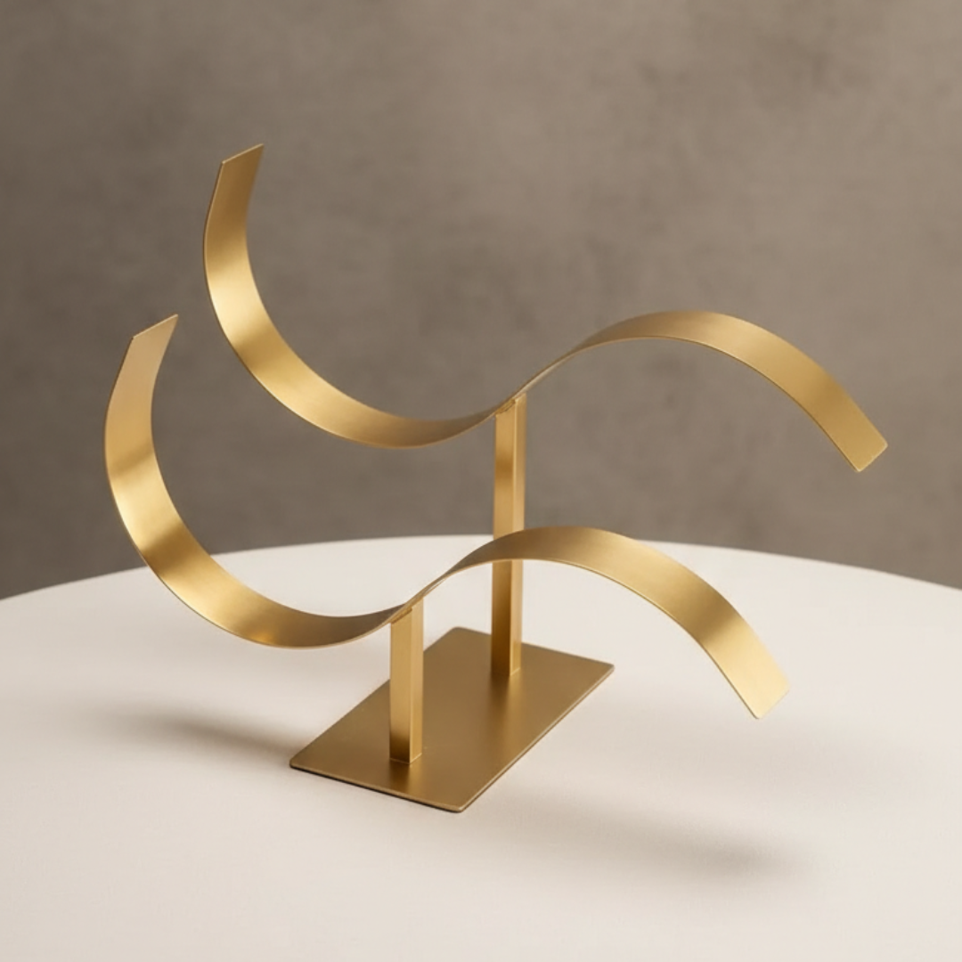 Gold belt stand on a beige surface with a neutral background